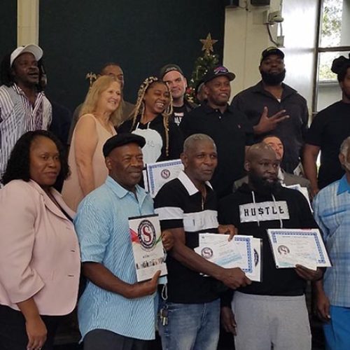 The graduates on December 11, 2021 are pictured in the back row.  In the front row are the instructors and meeting presenters.